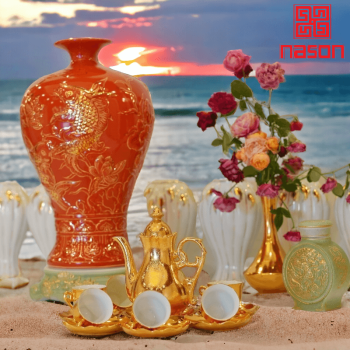 Bình hút lộc màu đỏ hoa văn nổi (sen cá chép)